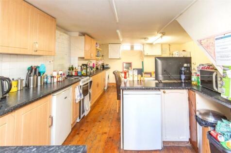 A well-organized and bright kitchen area with a...