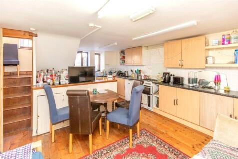 A bright, spacious living room with a comfortab...