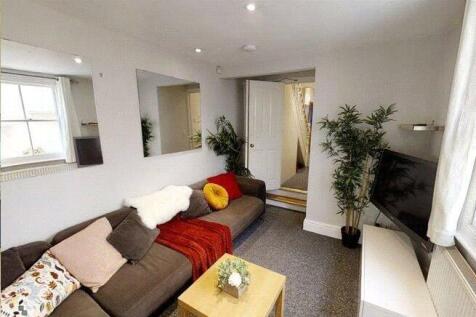 A cozy and inviting living room featuring a com...