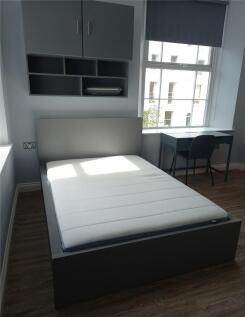 A modern double bedroom featuring a comfortable...