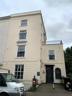 Elegant cream-colored terraced house with class...