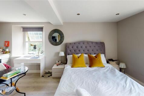 Bright and inviting master bedroom featuring a ...