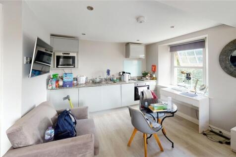 Bright and modern living space featuring a comp...