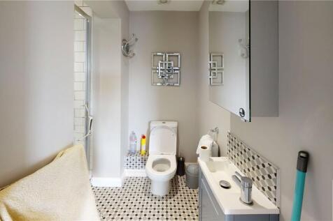 Bright and clean bathroom featuring a modern wh...