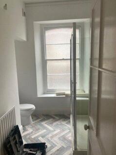 A clean and bright bathroom featuring a modern ...