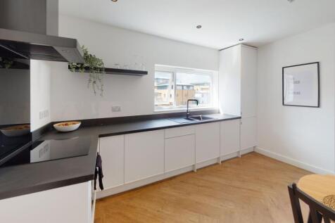 Modern and bright kitchen area featuring sleek ...