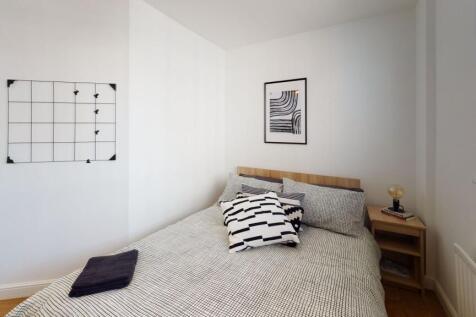 Bright and inviting master bedroom featuring a ...
