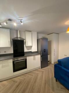 Bright and stylish living area featuring contem...