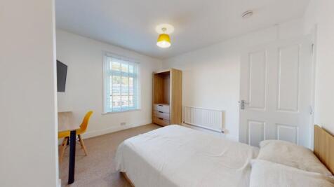 Bright and inviting bedroom featuring a double ...