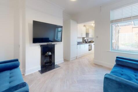 Bright and airy living room featuring contempor...