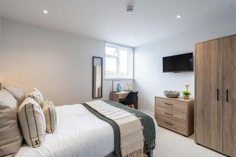 Bright and inviting master bedroom featuring a ...