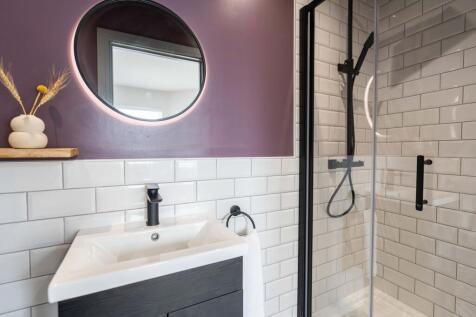 Modern bathroom featuring a sleek sink with a d...