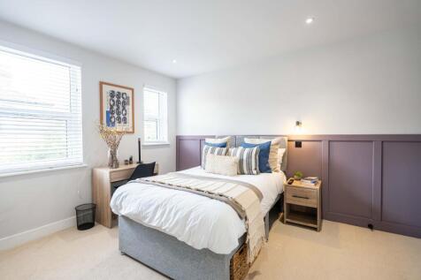 A beautifully decorated double bedroom featurin...