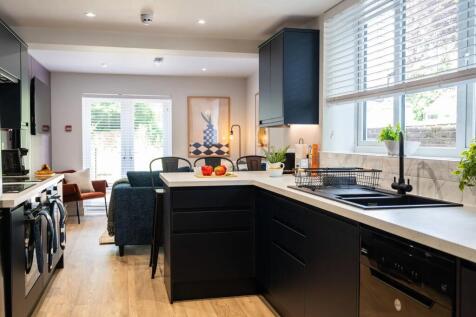 Modern and stylish kitchen with sleek black cab...