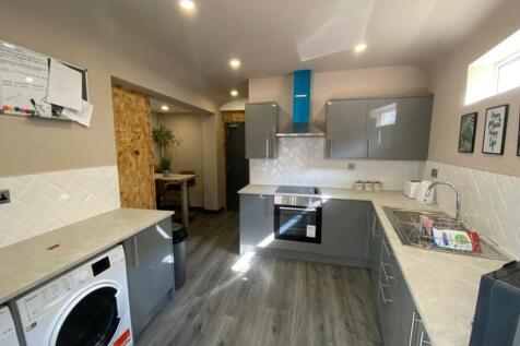 Modern kitchen featuring sleek cabinetry and am...