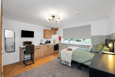 Bright and modern living area featuring a spaci...