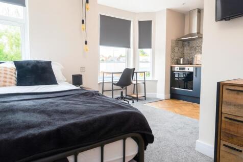 Bright and modern living space featuring large ...