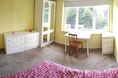 Bright and cheerful bedroom with soft yellow wa...