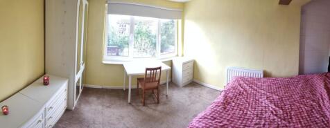 Bright and welcoming single bedroom featuring a...