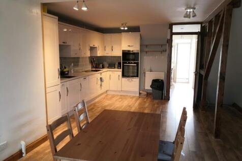 A bright and spacious kitchen featuring modern ...
