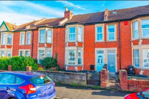 The front view of a well-maintained red brick p...