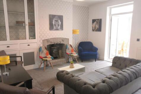 A spacious and well-decorated modern living roo...