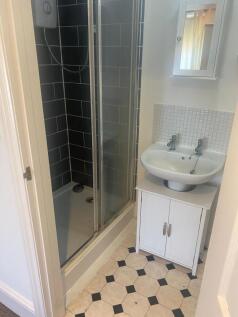 A clean, well-maintained bathroom featuring a s...
