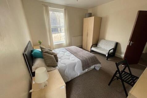 A bright and welcoming double bedroom featuring...