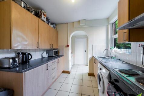 A well-maintained kitchen featuring ample cabin...
