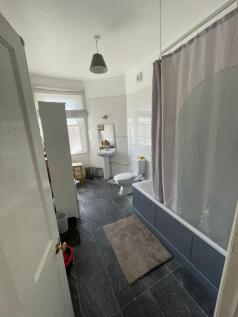 Bright and functional bathroom featuring a larg...