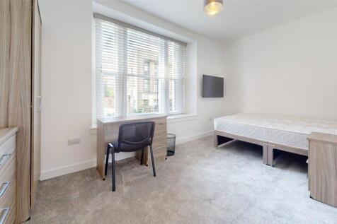 Bright and welcoming single bedroom featuring a...