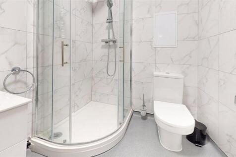 Modern and sleek bathroom with a spacious showe...