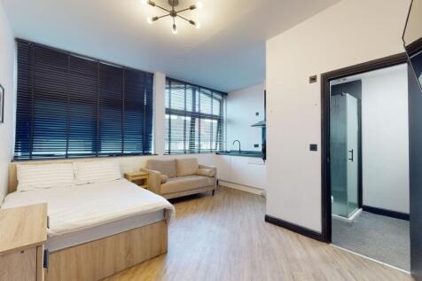 A modern, well-lit living room featuring large ...