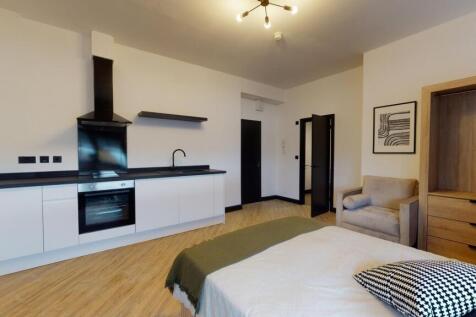 Modern and stylish living area featuring a slee...