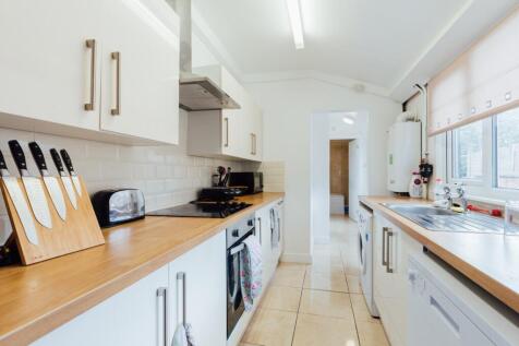 Bright and modern kitchen featuring ample count...