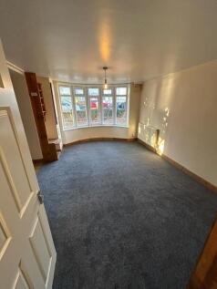 Bright and spacious living room with large bay ...