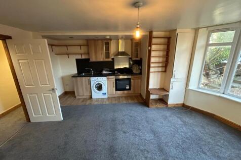 A spacious and welcoming living area featuring ...