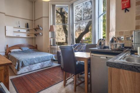 Bright and cozy living space featuring a large ...