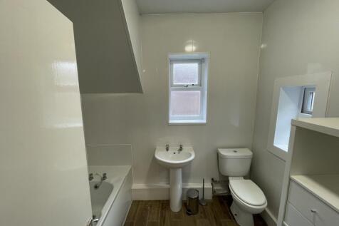Bright and modern bathroom featuring a stylish ...