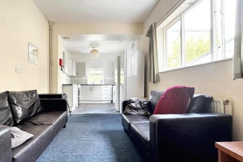 A spacious and inviting living room with large ...