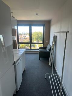 Bright and airy living space with a large windo...