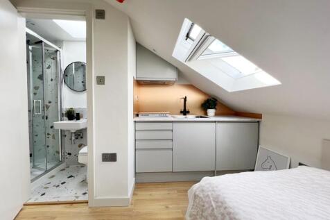 Bright and modern studio space featuring a cozy...