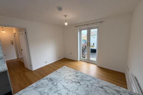 Bright and spacious living room with large doub...