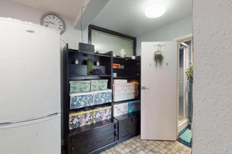 A well-organized kitchen space featuring shelve...