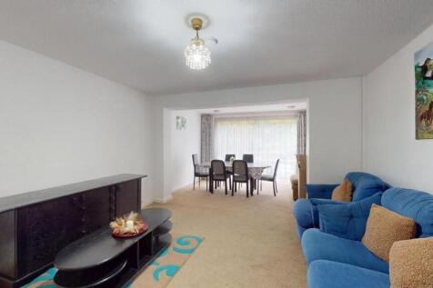 A contemporary living room featuring a comforta...