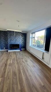 Bright and spacious living room featuring a lar...