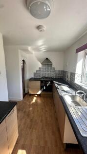 Bright and functional kitchen with ample counte...
