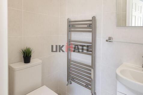 Modern and clean bathroom with a white toilet, ...
