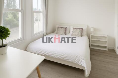 Bright and inviting double bedroom featuring a ...