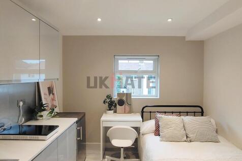 A bright and modern living space featuring a co...